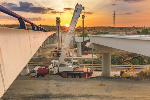 Brückenbau Baumaschinen Baustelle Sonnenuntergang